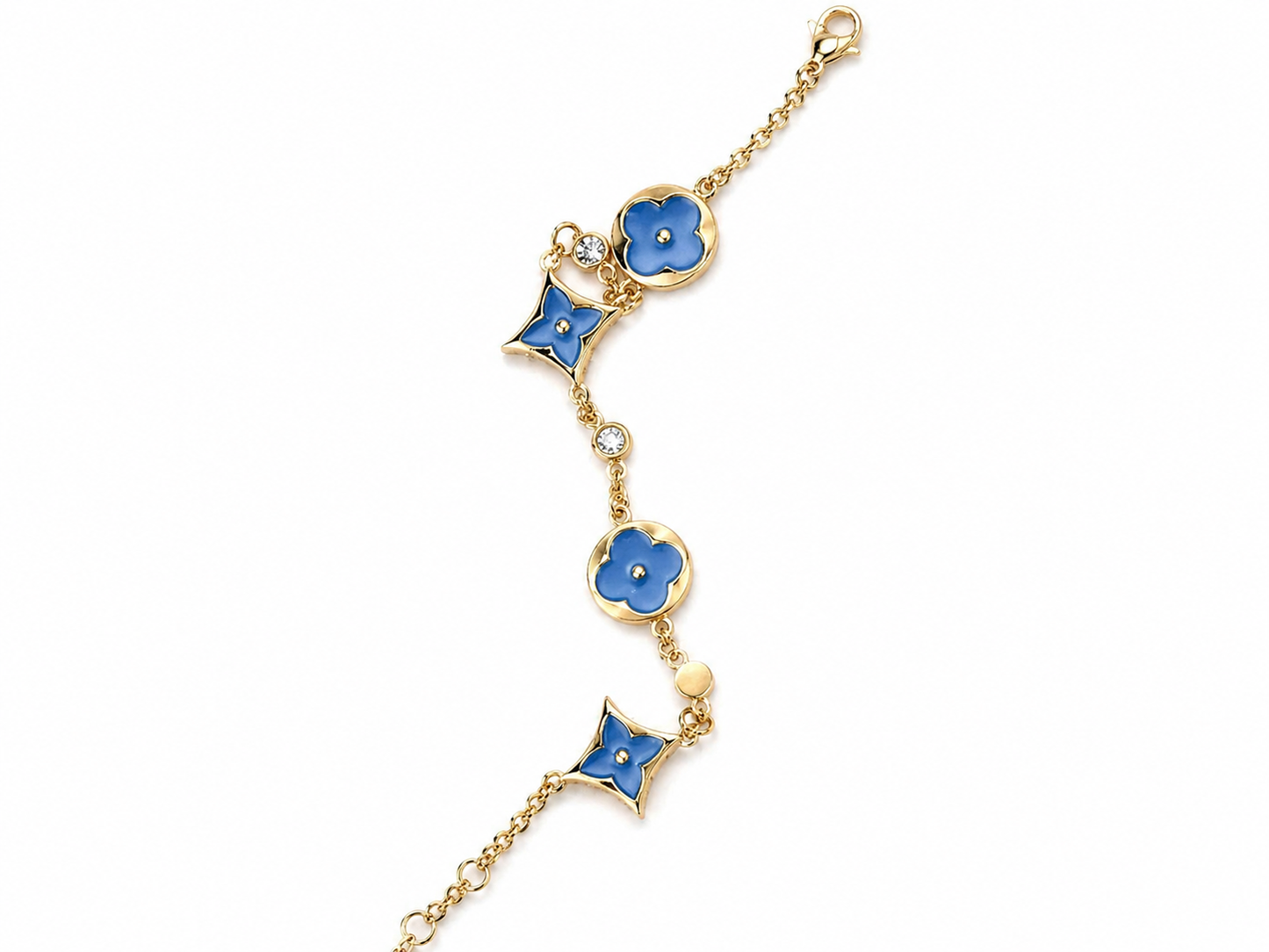 gold-tone charm bracelet featuring stunning turquoise enamel accents.