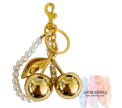 🍒 Gold Cherry Keychain with Pearl Handle – Elegant Bag & Purse Charm