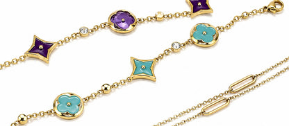 gold-tone charm bracelet featuring stunning turquoise enamel accents.