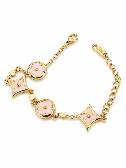 gold-tone charm bracelet featuring stunning turquoise enamel accents.