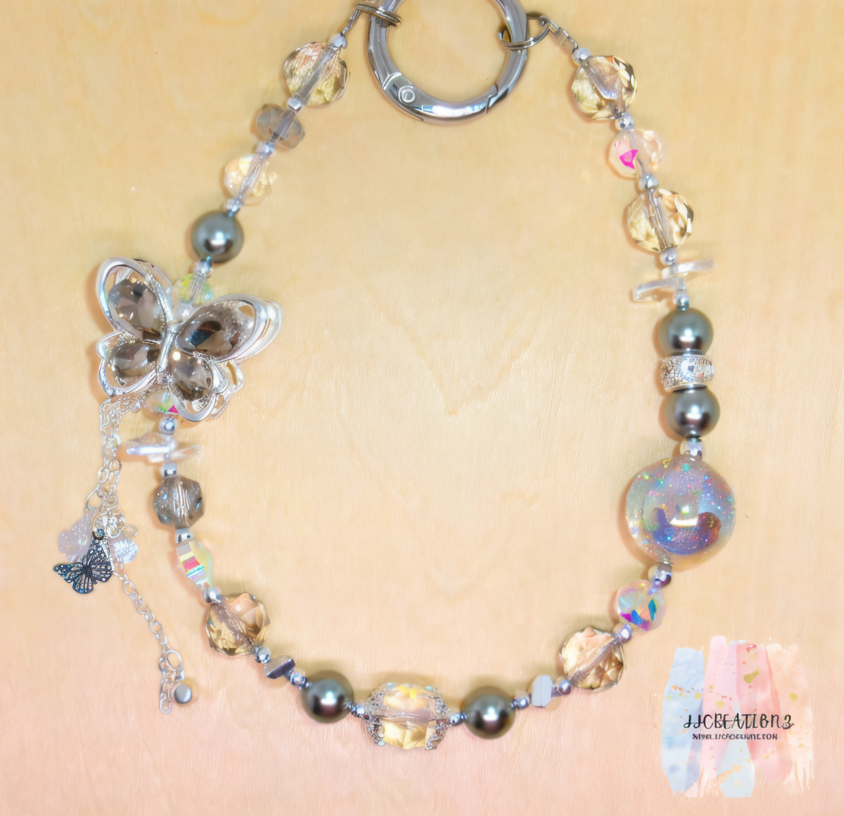 Crystal Butterfly Phone Charm – Grey Pearl & Iridescent Beaded Accessory