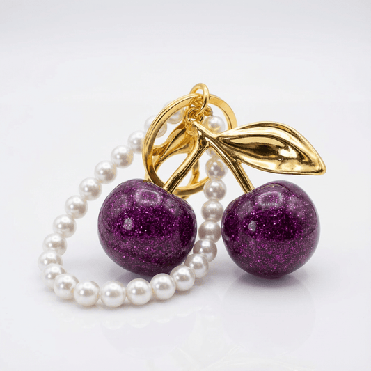 🍒 Elegant Cherry Keychain with Pearl Handle – Gold & Purple Glitter